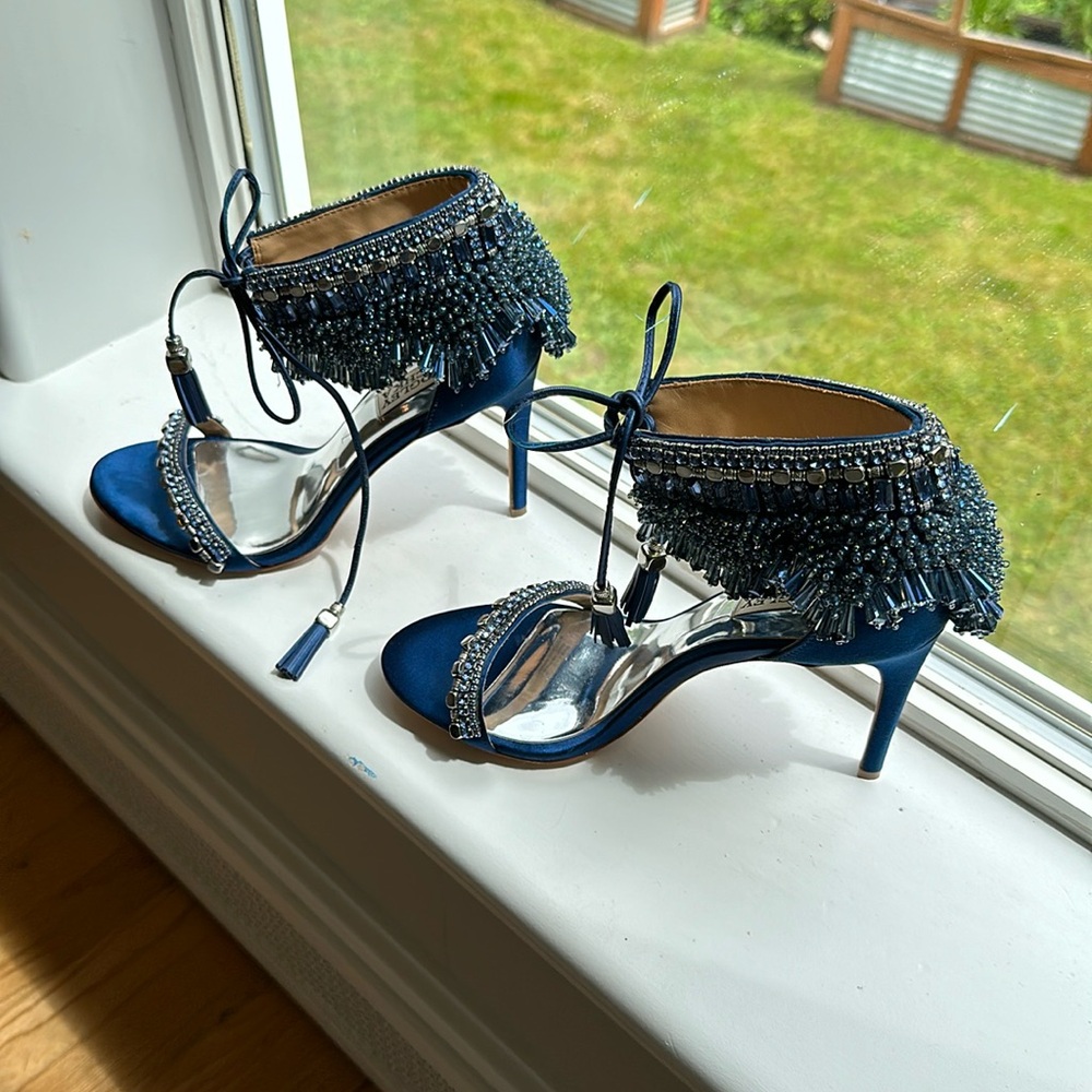 NEW. No wear, ended up getting married on a mountain, never wore them RARE color